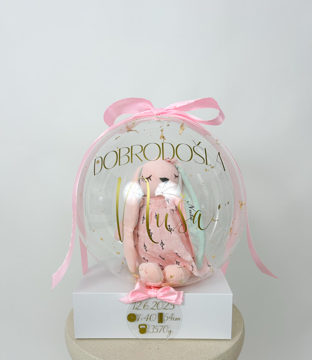 Balon ob rojstvu otroka z igračo roza