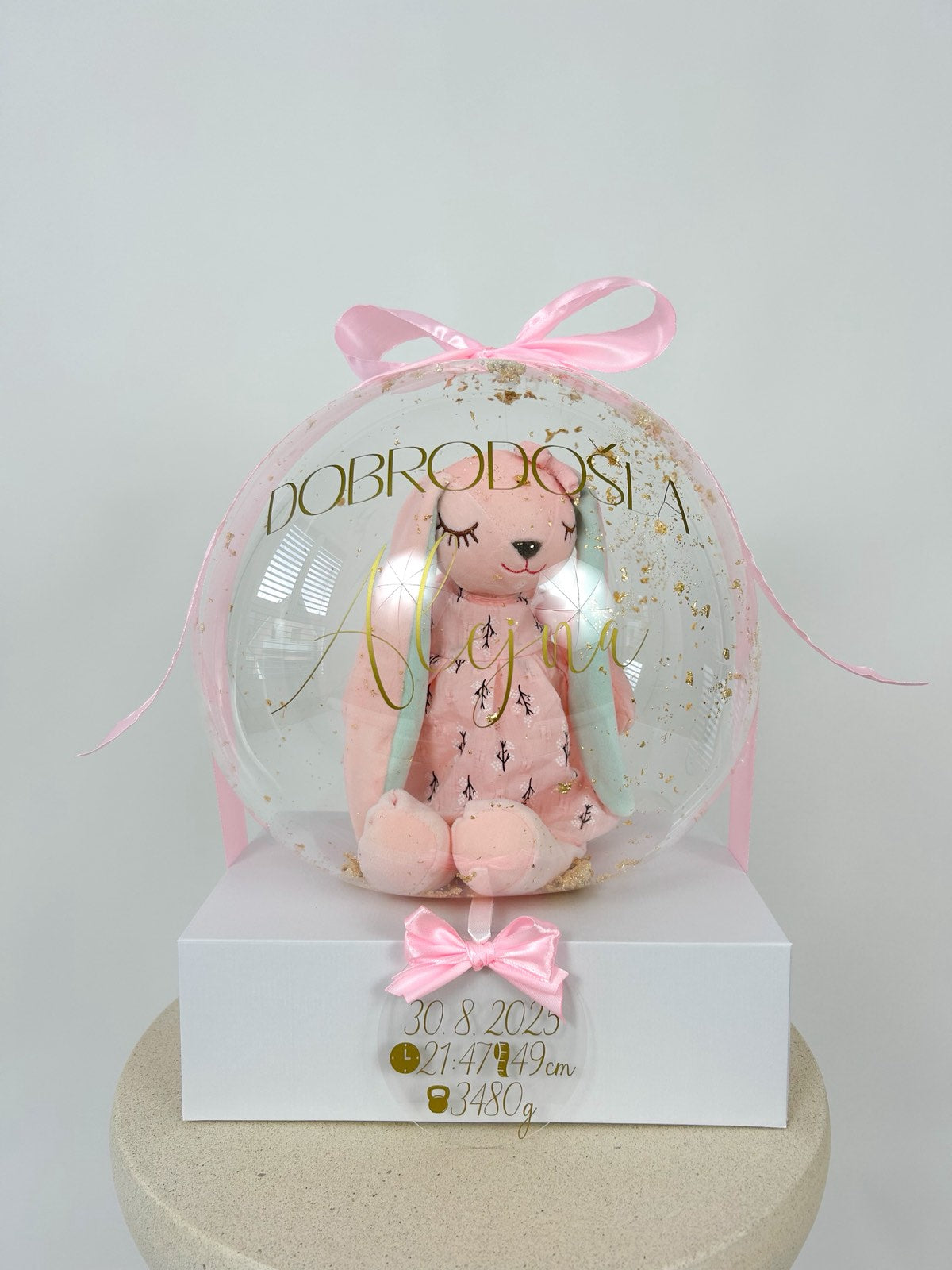 Balon ob rojstvu otroka z igračo roza